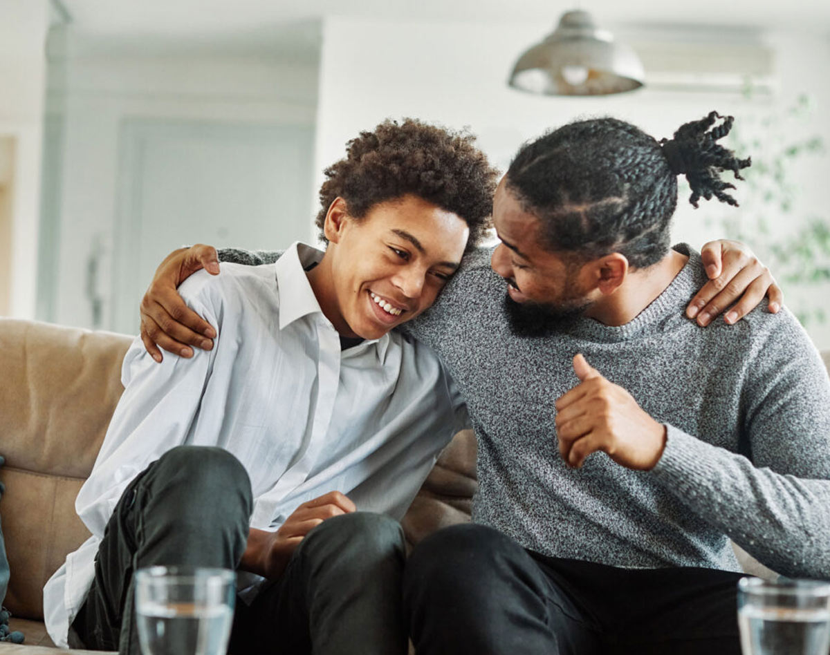 father and son hugging