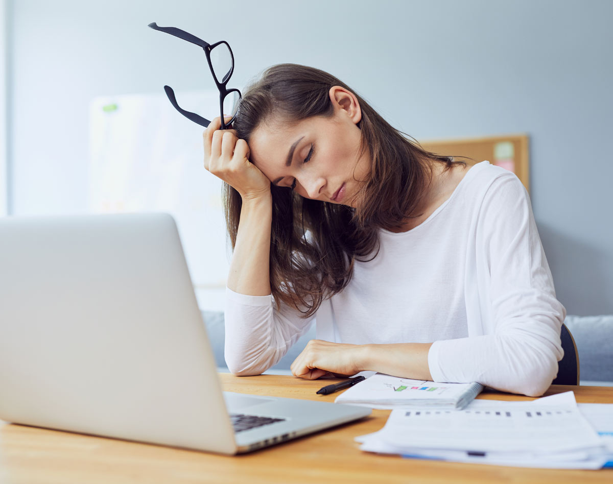 woman sleeping at office desk