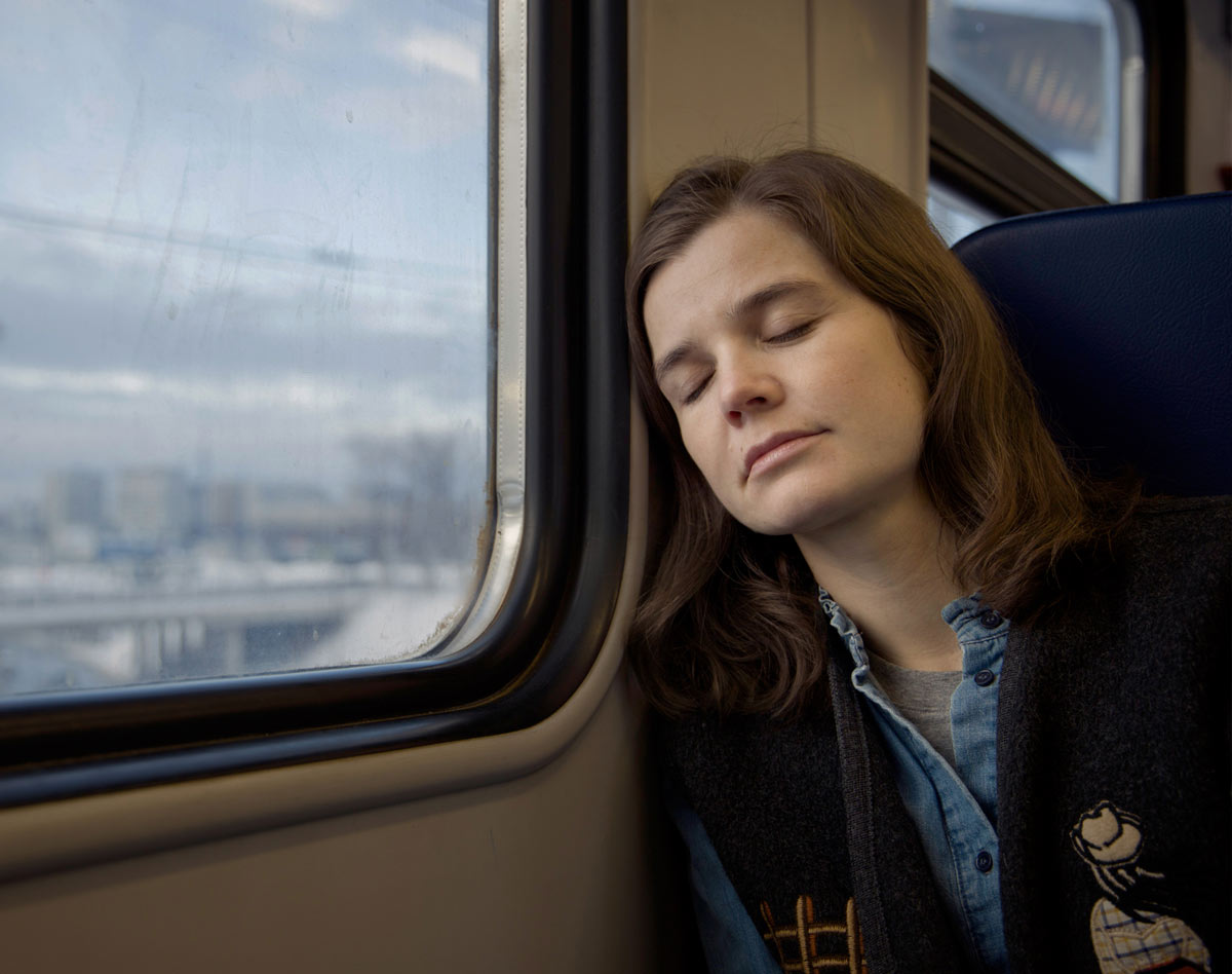 woman sleeping on train